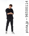 young man in black t-shirt and jeans dancing 96500114