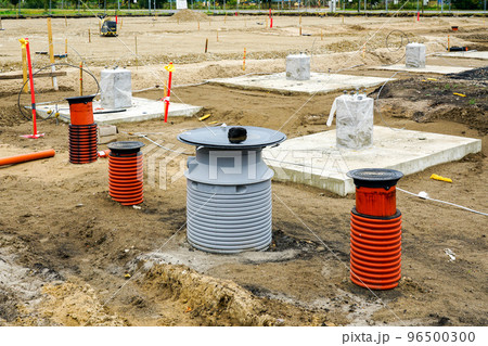 Concrete footings for steel columns at the construction site of a new industrial building Concrete footings for steel columns at the construction site of a new industrial building 96500300