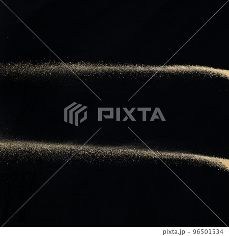 Sand flying explosion, Golden sand wave explode. Abstract sands cloud fly. Yellow colored sand splash throwing in Air. black background Isolated high speed shutter, throwing freeze stop motion 96501534