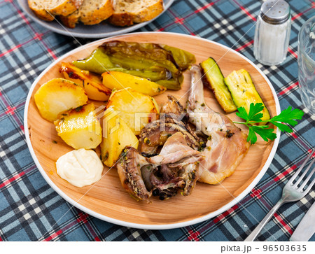 Appetizing rabbit with potatoes and vegetables 96503635