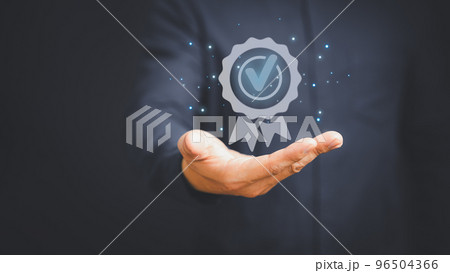 Quality assurance of business services, Businessman holding and showing the best quality assurance with golden five stars. Guarantee, Standards, ISO certification and testimonial concept. 96504366