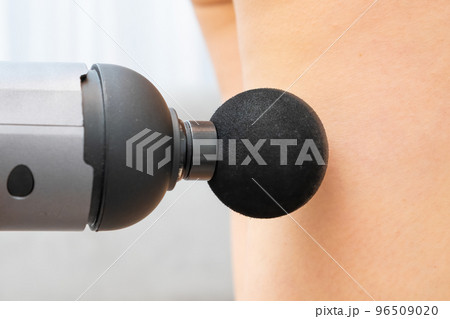 Massage gun for recovery of leg after after gym workout. Physiotherapy concept. Massage gun for recovery of leg after after gym workout. Physiotherapy concept. 96509020