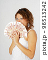 Young pretty woman with money currency 96513242