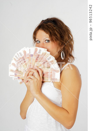 Young pretty woman with money currency 96513242