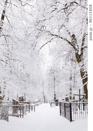 Cemetery in winter under the snow. Cemetery in the snow cover Cemetery in winter under the snow. Cemetery in the snow cover 96515808