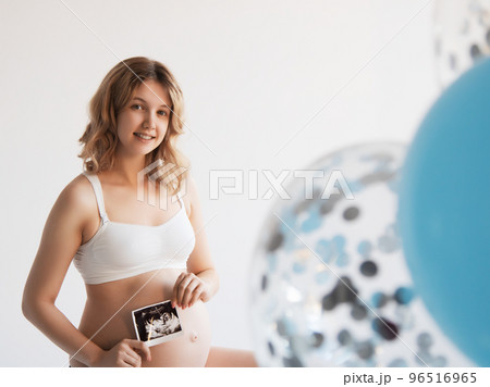Happy Pregnant Woman standing smile holding Happy Pregnant Woman standing smile holding 96516965