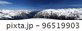 Panorama of high snow-capped mountain peaks and beautiful sky with clouds at sunny day. 96519903