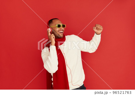 Winter Man Listening Music. Positive Multiracial Man Listening Song Headphones 96521763
