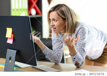 Financial problem, unexpected results, lack of money. Confused and stressed woman looking at computer screen. Financial problem, unexpected results, lack of money. Confused and stressed woman looking at computer screen. 96523070