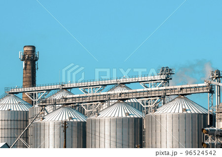 Towers of snowy silos in winter 96524542