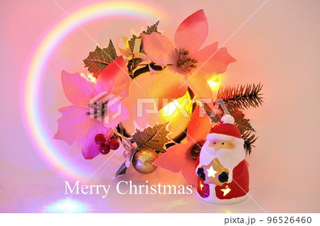 クリスマスのイメージ素材 ポインセチアとサンタクロース 虹とロゴ入り