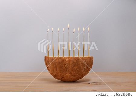 Creative Hanukkah menorah on a wooden table. Creative Hanukkah menorah on a wooden table. 96529686