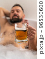 Man with beer in bath 96530600