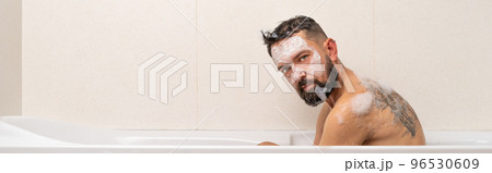 Bearded man sitting in bath 96530609