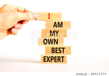 I am my own best expert symbol. Concept words I am my own best expert on wooden blocks on a beautiful white table white background. Businessman hand. Business i am my own best expert concept. 96531574