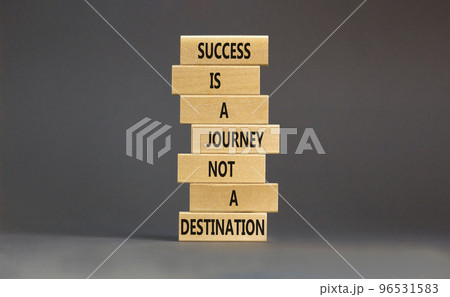 Success is a journey symbol. Concept words Success is a journey not a destination on wooden blocks on a beautiful grey table grey background. Business and success journey concept. Copy space Success is a journey symbol. Concept words Success is a journey not a destination on wooden blocks on a beautiful grey table grey background. Business and success journey concept. Copy space 96531583