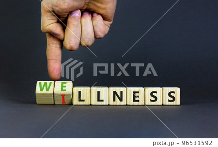 Wellness or illness symbol. Concept words Wellness and Illness on wooden cubes. Doctor hand. Beautiful grey table grey background. Medicak, healthy lifestyle wellness or illness concept. Copy space. Wellness or illness symbol. Concept words Wellness and Illness on wooden cubes. Doctor hand. Beautiful grey table grey background. Medicak, healthy lifestyle wellness or illness concept. Copy space. 96531592