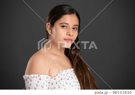 Portrait of latin girl with piercing in ear Portrait of latin girl with piercing in ear 96531630