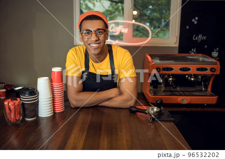 Smiling young coffee worker in his workplace 96532202