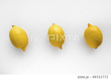 Yellow ripe lemon on a white background. Juicy lemons close-up. Isolate of the fruit of a yellow lemon. Yellow ripe lemon on a white background. Juicy lemons close-up. Isolate of the fruit of a yellow lemon. 96532772