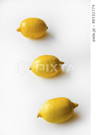 Yellow ripe lemon on a white background. Juicy lemons close-up. Isolate of the fruit of a yellow lemon. Yellow ripe lemon on a white background. Juicy lemons close-up. Isolate of the fruit of a yellow lemon. 96532774