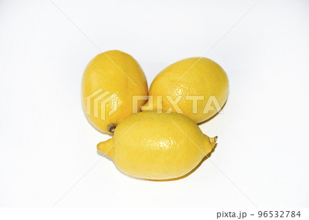 Yellow ripe lemon on a white background. Juicy lemons close-up. Isolate of the fruit of a yellow lemon. 96532784