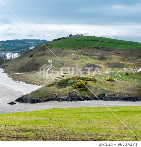 Picturesque hills in the south of Ireland, a view of the Clonakilty seashore. Cloudy, rainy weather. Landscapes along the Wild Atlantic Way. Picturesque hills in the south of Ireland, a view of the Clonakilty seashore. Cloudy, rainy weather. Landscapes along the Wild Atlantic Way. 96534271