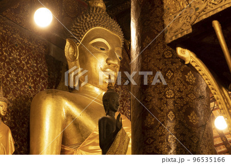 Huge seated Buddha in Wat Xieng Thong temple in Luang Prabang, Laos 96535166