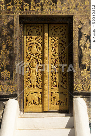 Gilded door at Wat Xieng Thong temple, Luang Prabang, Laos 96535212