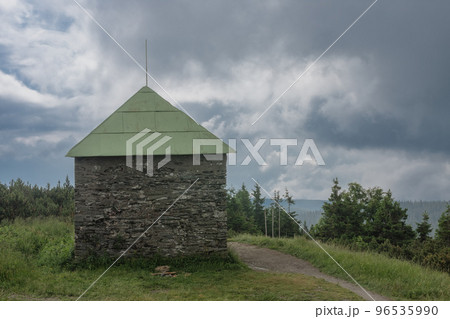 Stone shed , refuge for tourists in case of bad weather, on a summer foggy day, Jesenik mountains Stone shed , refuge for tourists in case of bad weather, on a summer foggy day, Jesenik mountains 96535990