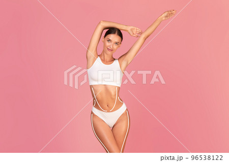 Beautiful slim female in underwear with dashed lines on body Beautiful slim female in underwear with dashed lines on body 96538122