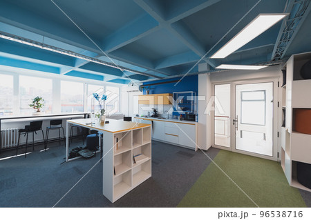 Photo of a modern office where programming, digital marketing and web design projects are done. Office with modern furniture and glass office 96538716