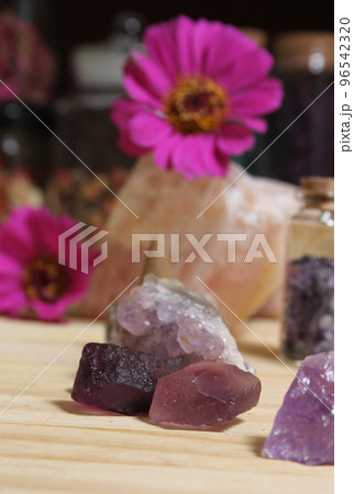 Amethyst Crystals With Flowers and Incense Cones on Meditation Table Amethyst Crystals With Flowers and Incense Cones on Meditation Table 96542320