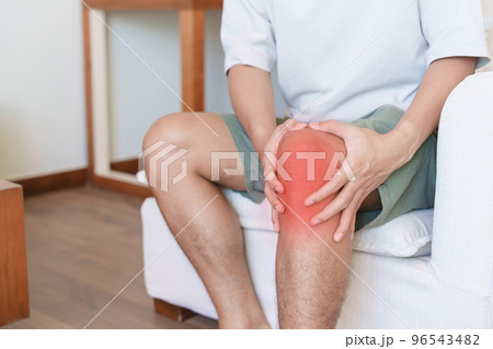 Man having knee ache and muscle pain due to Runners Knee or Patellofemoral Pain Syndrome, osteoarthritis, arthritis, rheumatism and Patellar Tendinitis. medical concept 96543482