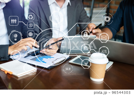 Working team meeting concept, business using laptop and digital tablet with marketing virtual icon . Working team meeting concept, business using laptop and digital tablet with marketing virtual icon . 96544303
