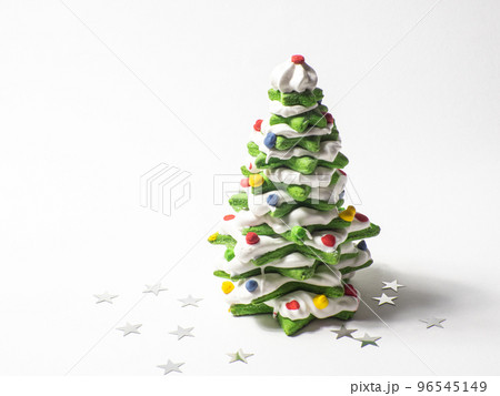 Green cookie christmas tree made by star cookie cutter on white background Green cookie christmas tree made by star cookie cutter on white background 96545149