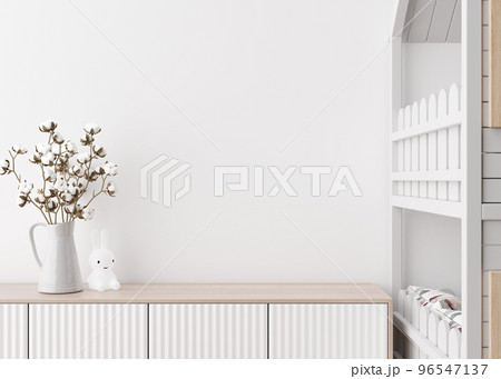 Empty white wall in modern child room. Mock up interior in scandinavian style. Copy space for your picture or poster. Bed, sideboard, cotton plant in vase. Cozy room for kids. 3D rendering. 96547137