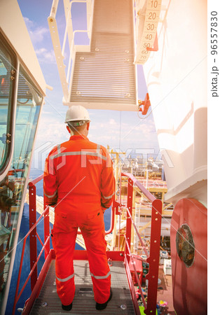 Offshore oil and gas industry and operated by technician petroleum. Worker walking to oil and gas plant for work as routine plan. Maintenance and Operation work scope in oil and gas plant. Offshore oil and gas industry and operated by technician petroleum. Worker walking to oil and gas plant for work as routine plan. Maintenance and Operation work scope in oil and gas plant. 96557830