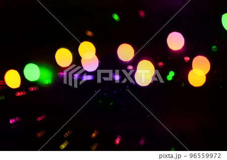 Blurred light garland background, golden and colorful bokeh texture Blurred light garland background, golden and colorful bokeh texture 96559972