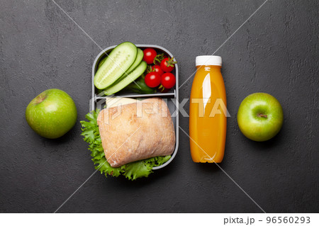 Lunch box with sandwich, vegetables and juice Lunch box with sandwich, vegetables and juice 96560293