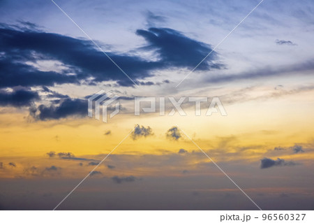 Calm sea with sunset sky and sun through the clouds over. Meditation ocean and sky background. Tranquil seascape. Horizon over the water 96560327