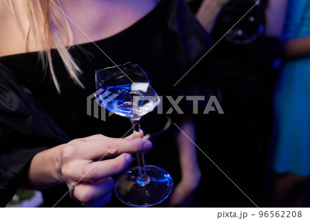 broken glass of champagne in hand Clinking glasses with alcohol and toasting, party. broken glass of champagne in hand Clinking glasses with alcohol and toasting, party. 96562208