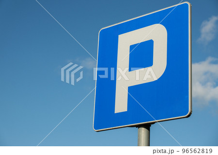 Parking sign showing free places. Traffic parking sign with clean sky and light ray. Cars became biggest problem for urban ecology due emission Parking sign showing free places. Traffic parking sign with clean sky and light ray. Cars became biggest problem for urban ecology due emission 96562819