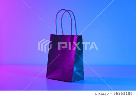 Paper black bag in neon light. The concept of 96563189