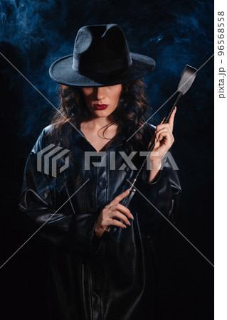 Sexy female dominant mistress with a whip flogger for BDSM sex Sexy female dominant mistress with a whip flogger for BDSM sex 96568558