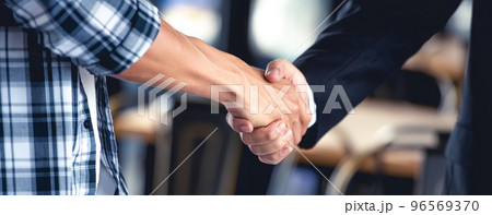 Professional young business people handsake, united, joining , combine hands together expressing positive, unity, volunteer , teamwork concepts.. 96569370