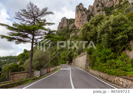 Scenic Road by Rocky Cliffs and Mountain Landscape on the Tyrrhenian Sea. Amalfi Coast, Italy. Scenic Road by Rocky Cliffs and Mountain Landscape on the Tyrrhenian Sea. Amalfi Coast, Italy. 96569723