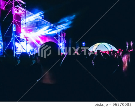 Crowd raising their hands and enjoying great festival party or concert. 96570082