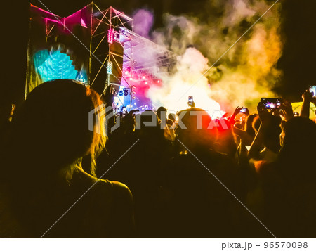 Crowd raising their hands and enjoying great festival party or concert. 96570098