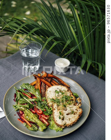 Sweet potato fries with rosmary and fresh salad 96571630